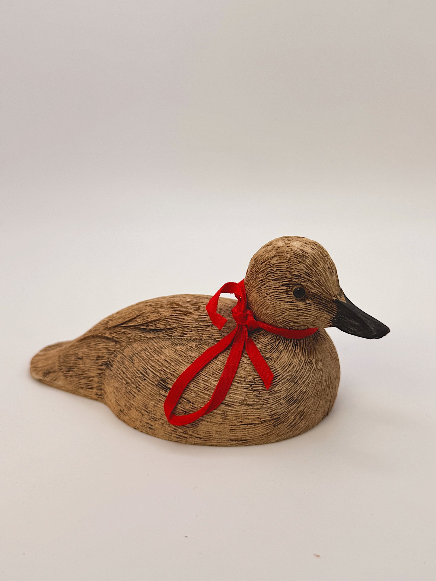 Vintage Wooden Duck Figurine with Red Ribbon Collar